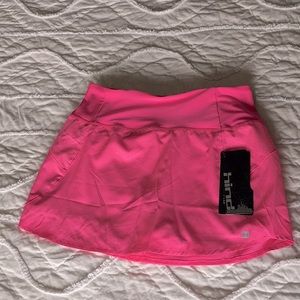 NWT Pink athletic skirt with built-in spandex shorts & pockets.